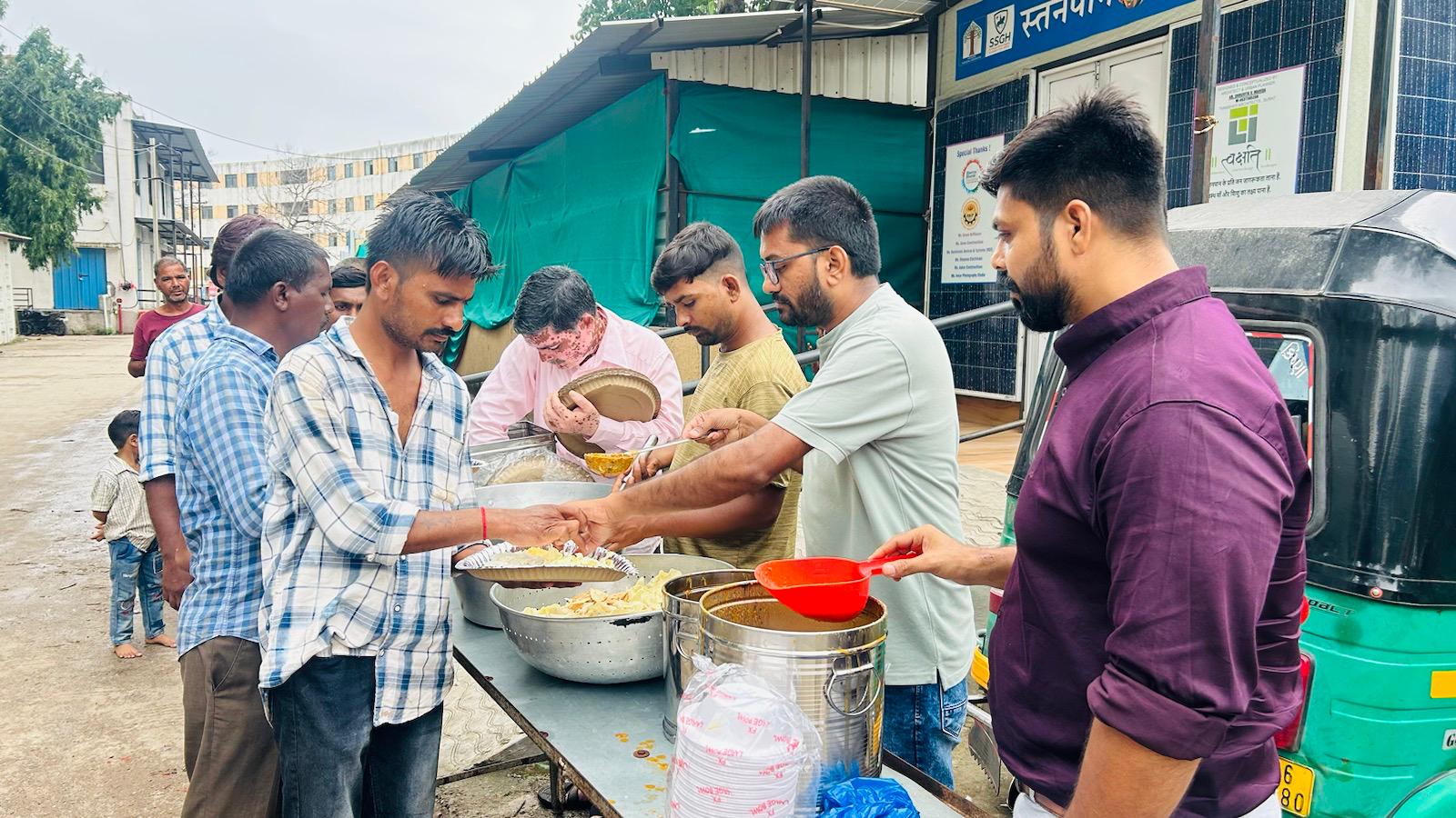 NGO volunteers helping homeless person
